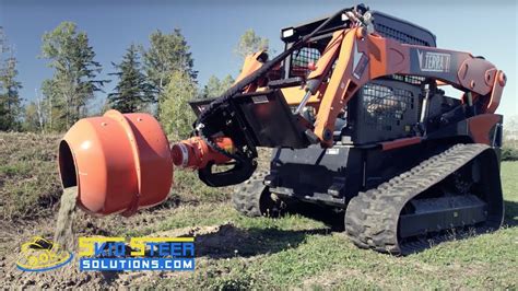 puting in post in a vineyard with a skid steer|skid steer fence post installation.